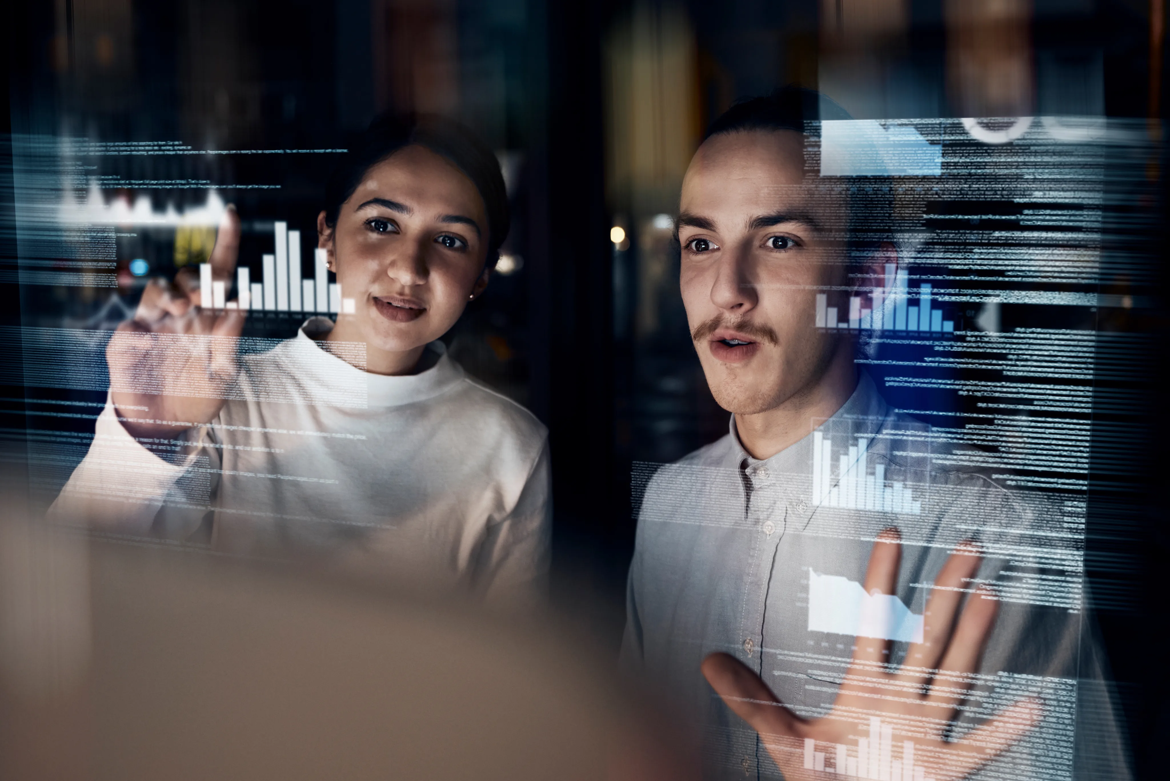Professionals reviewing data visualizations on a display