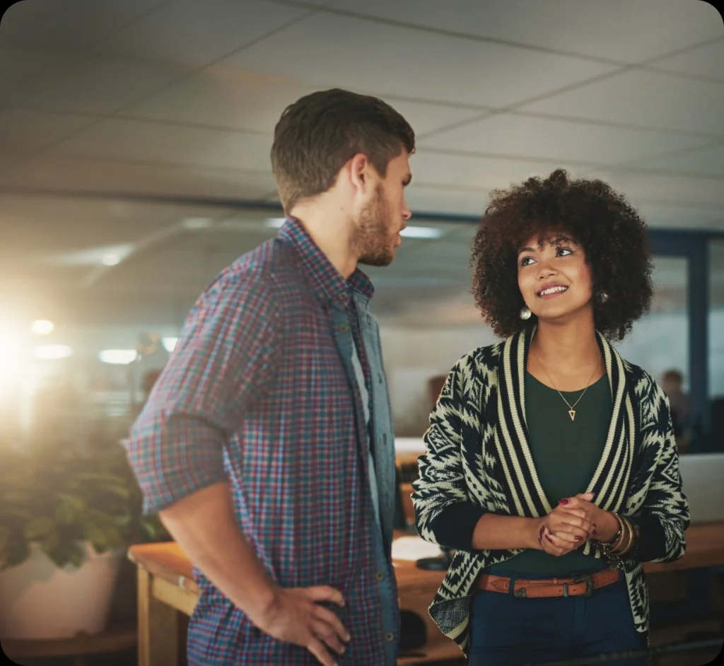 Two colleagues collaborating in a modern office