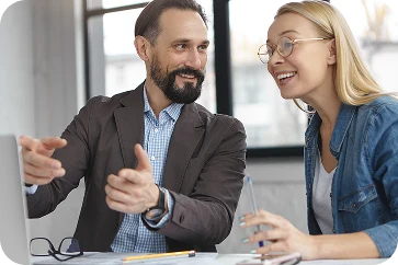 Team member in office with colleagues in the background